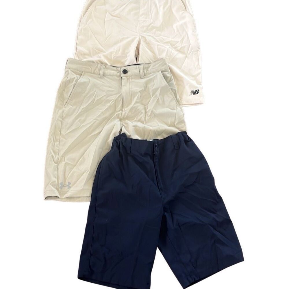 Bundle of boys shorts, new balance, and under Armour included sizes 14 to 16